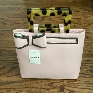 Pink purse with tortoise shell handles